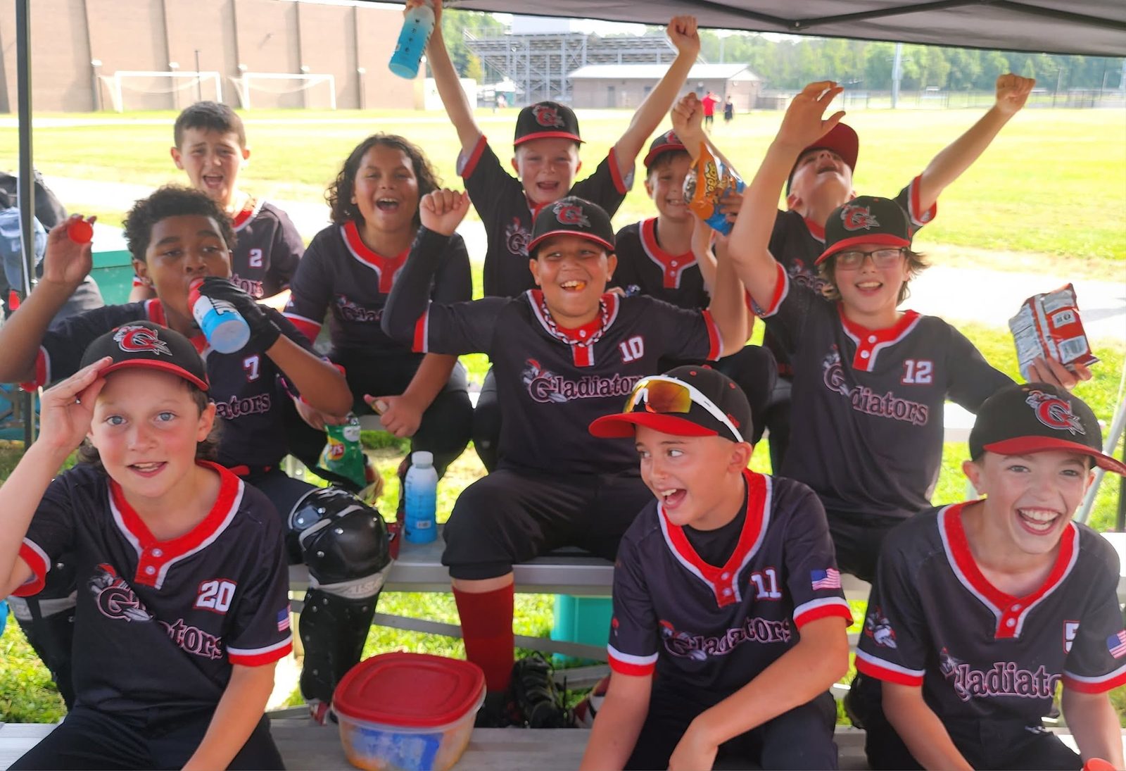 Team celebrating in the dugout