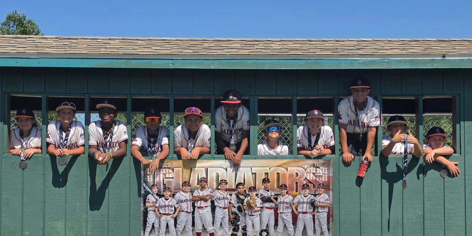 Team with medals in the dugout window cutouts